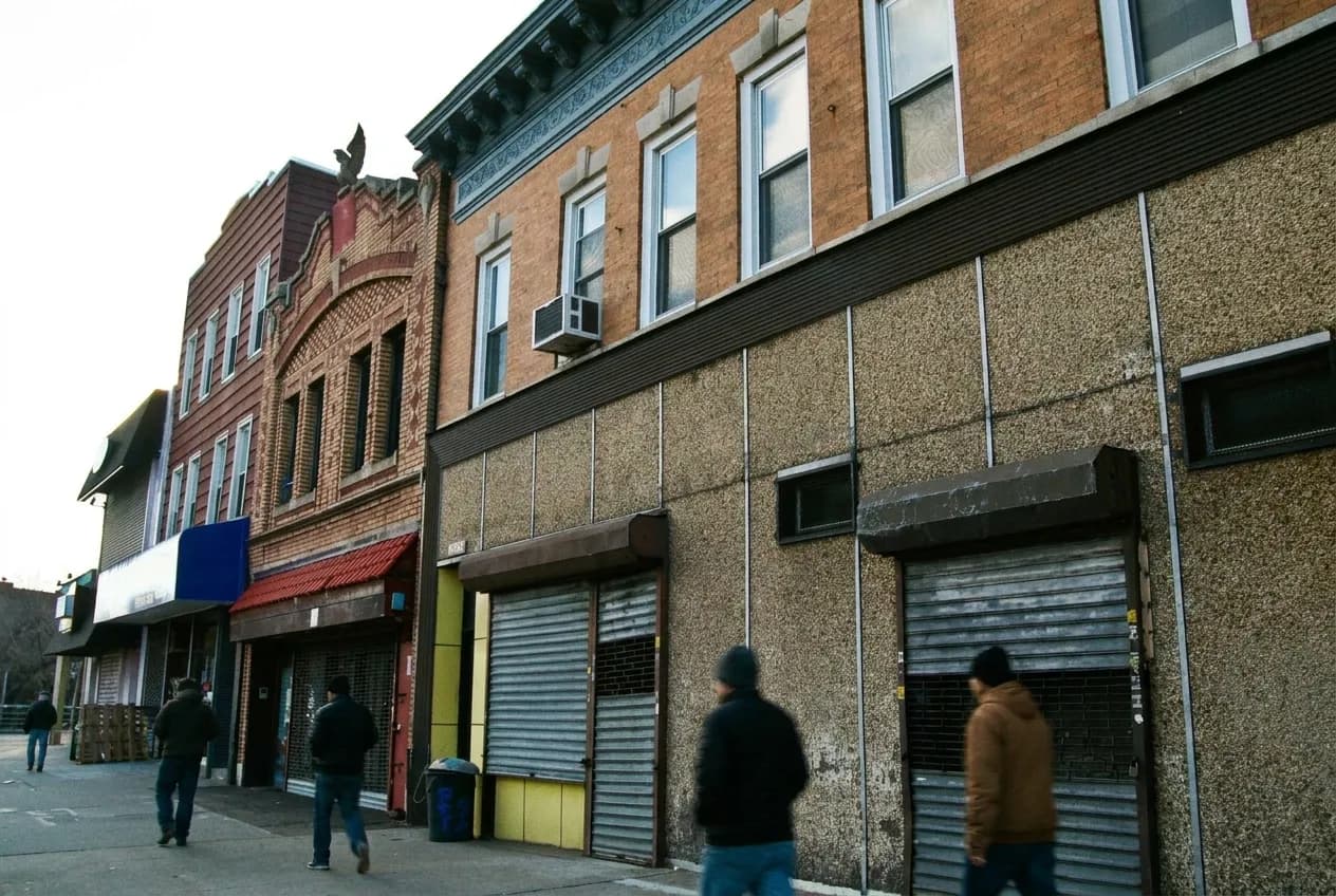 Street view of a neighborhood bakery and prepared food counter in Queens