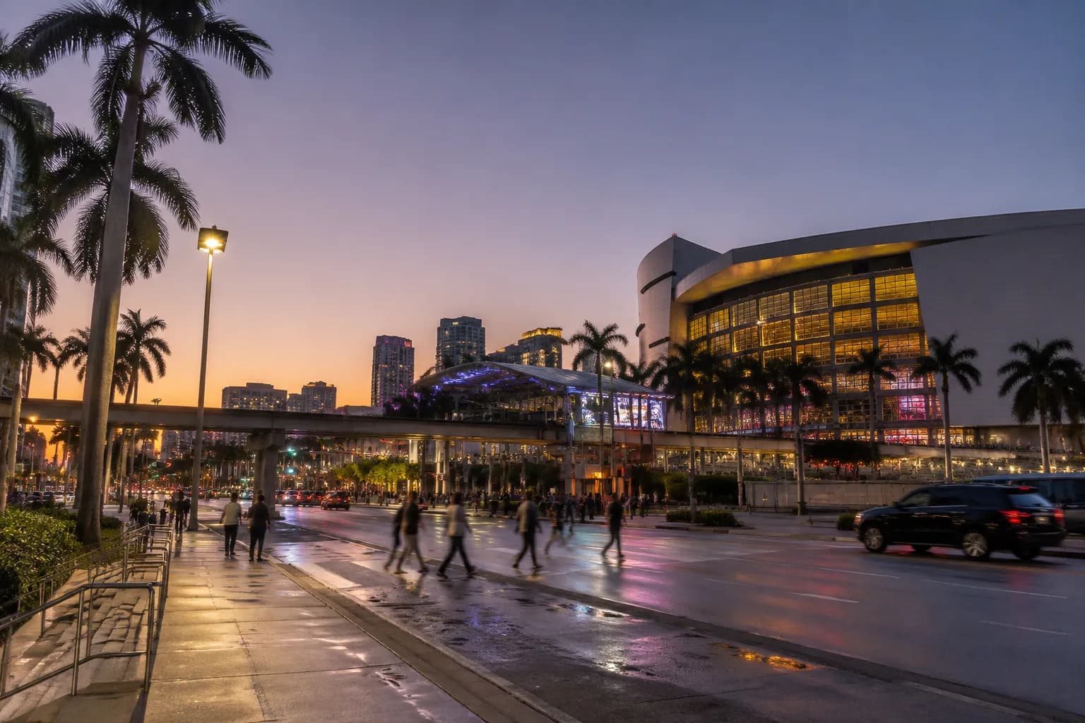 Biscayne Boulevard in downtown Miami at dusk with streetlights and palm trees