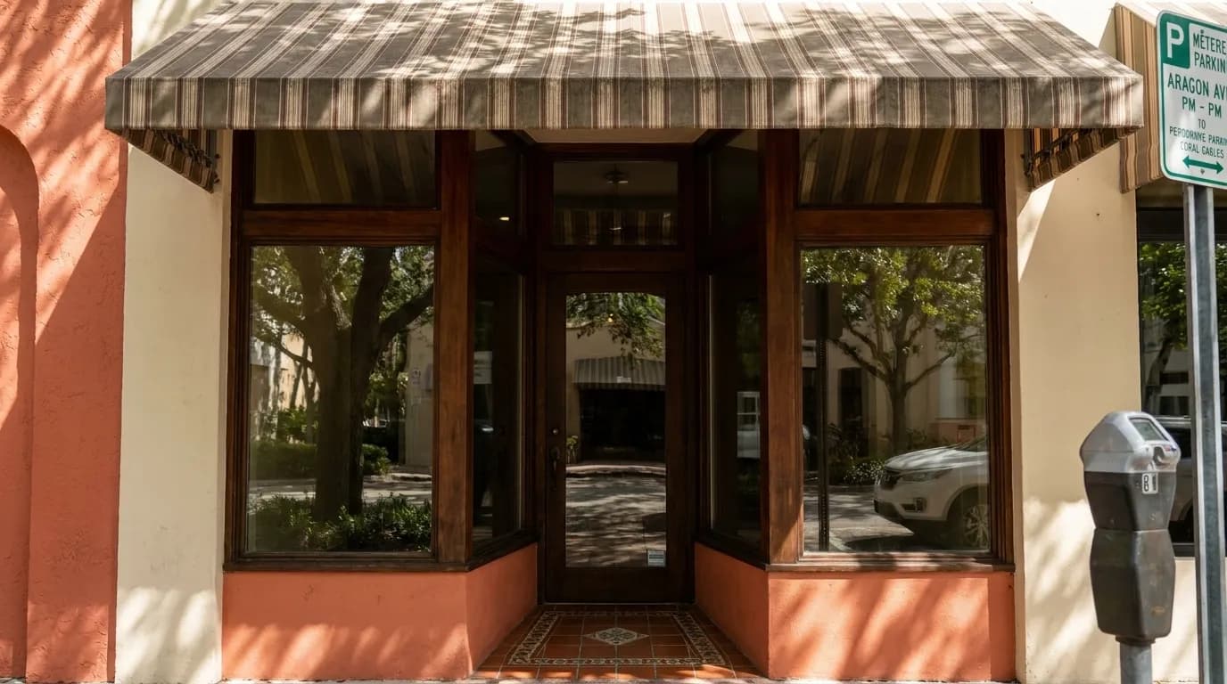 Shaded storefront entrance on Aragon Avenue in Coral Gables with awning and tiled entryway