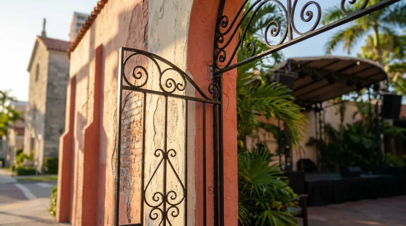 Entrance detail at Ball & Chain in Little Havana showing courtyard gate and stucco wall in afternoon light