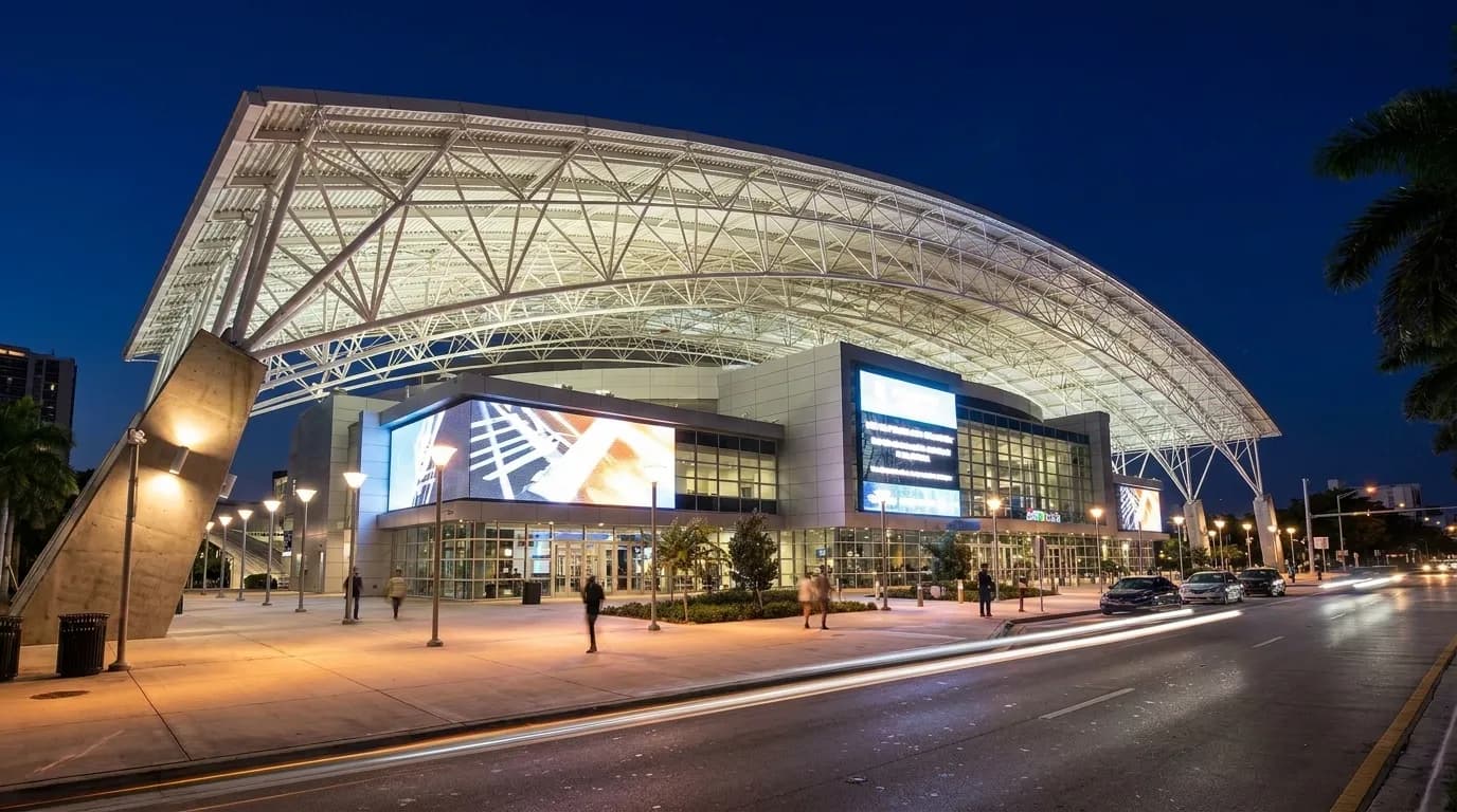 Kaseya Center exterior at night with lit entrance and street traffic in downtown Miami