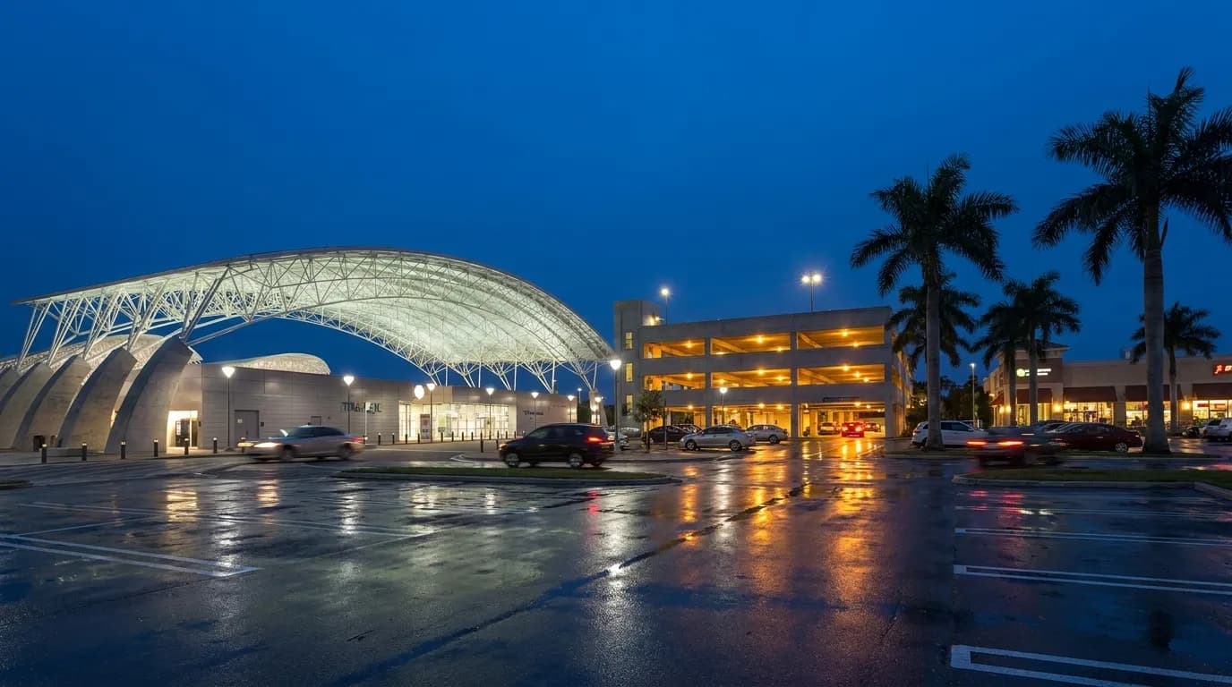 Evening view of a busy parking lot and structure near Dadeland Mall in Miami