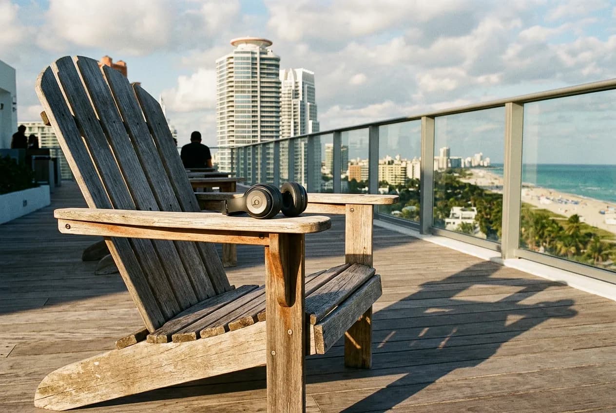 Close-up of an empty Adirondack chair and wireless headphones on a rooftop deck before a film begins