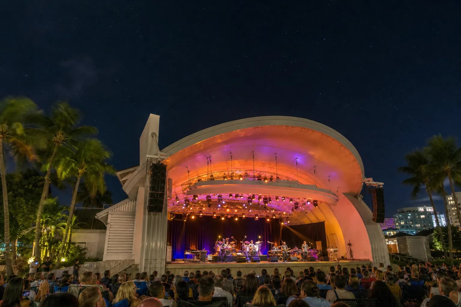 Open-air stage and canopy at the Miami Beach Bandshell during a nighttime concert