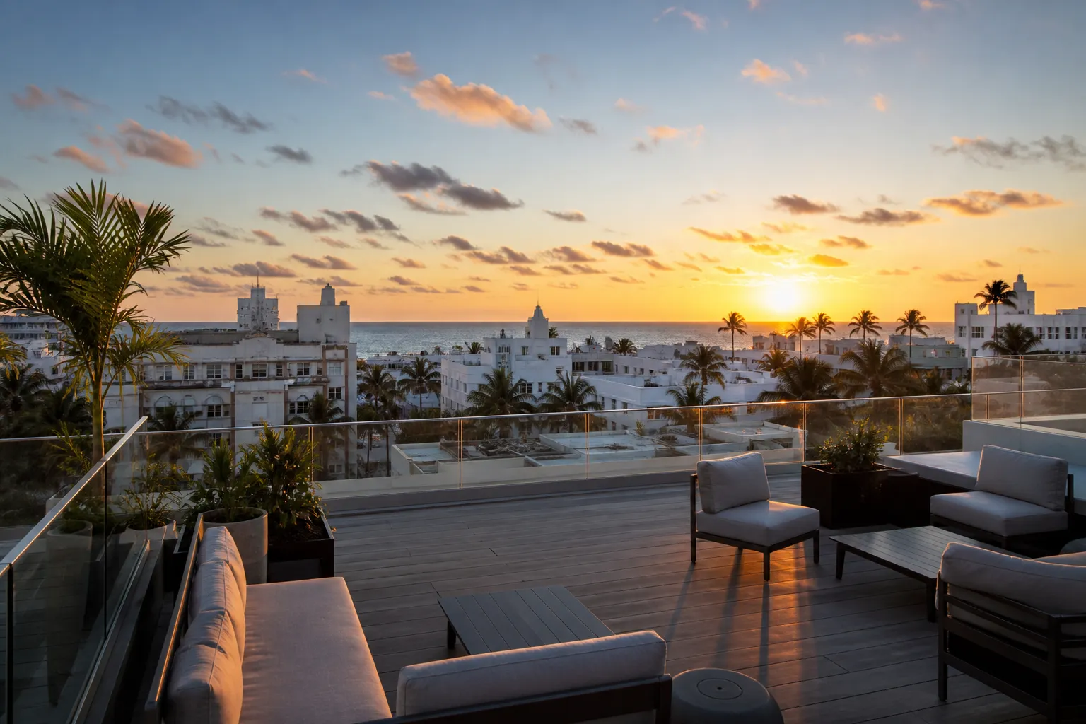 Miami Beach rooftop terrace with ocean and skyline view at golden hour