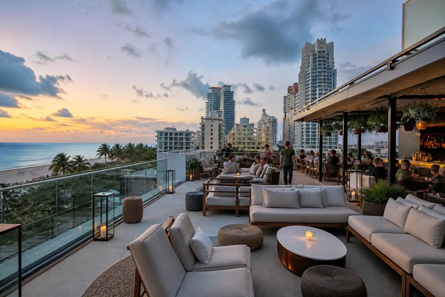 Wide rooftop lounge view with city light and sea breeze near the beach