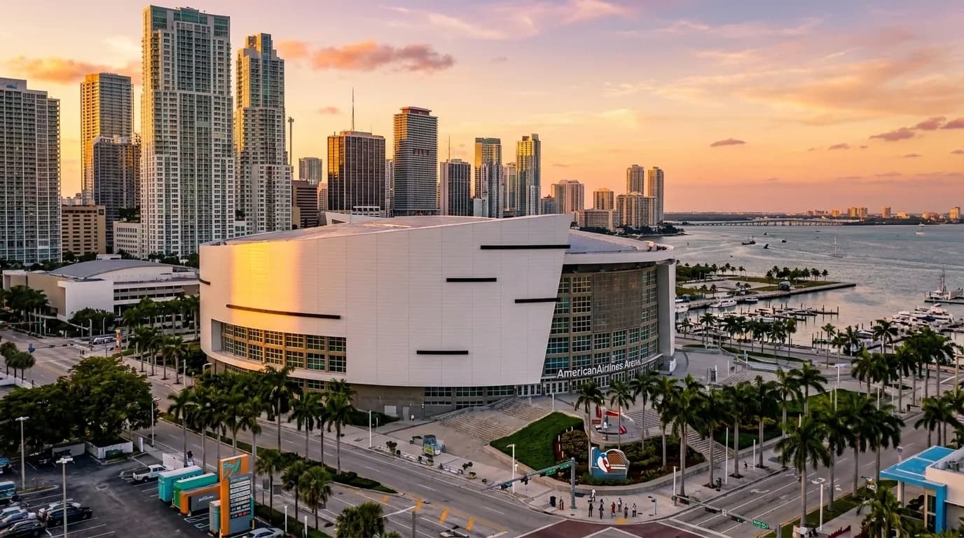 Kaseya Center exterior in downtown Miami at dusk with surrounding high-rise buildings