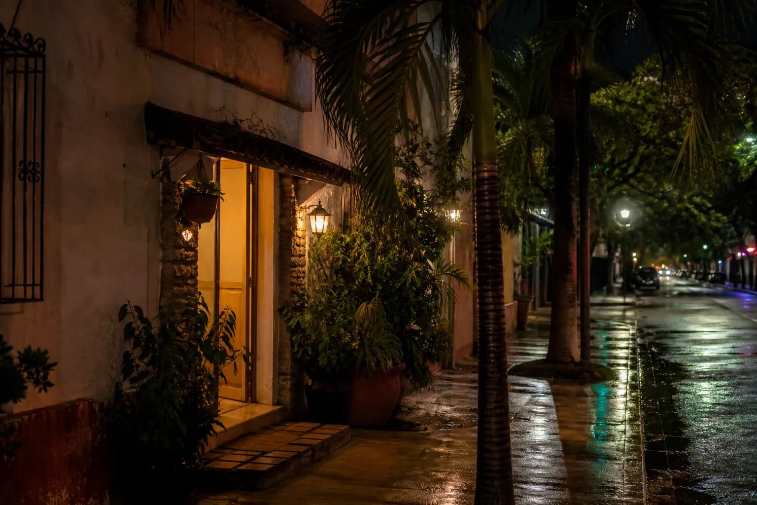 Calle Ocho streetscape in Little Havana at dusk with warm storefront light and pedestrians