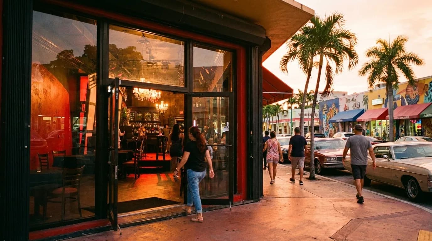 Colorful storefront lights along Calle Ocho in Little Havana at dusk