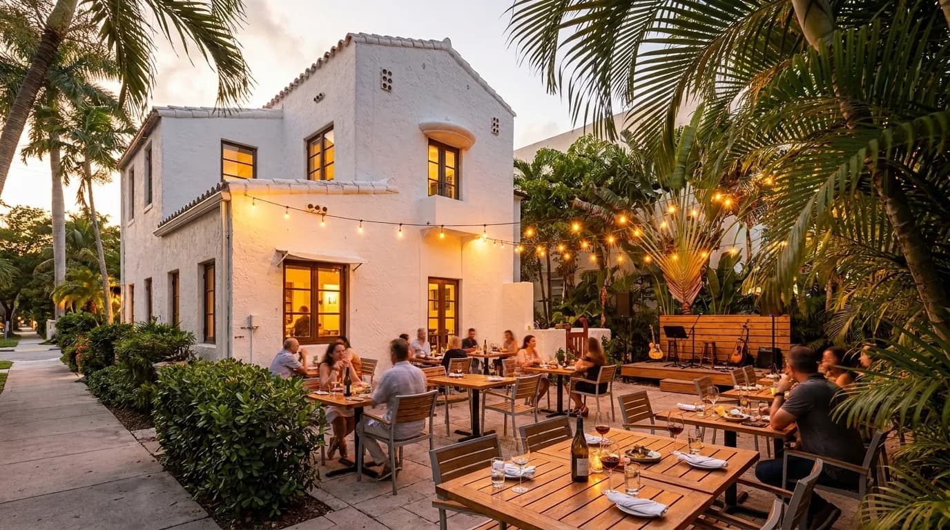 Lagniappe's intimate backyard patio with string lights and small stage