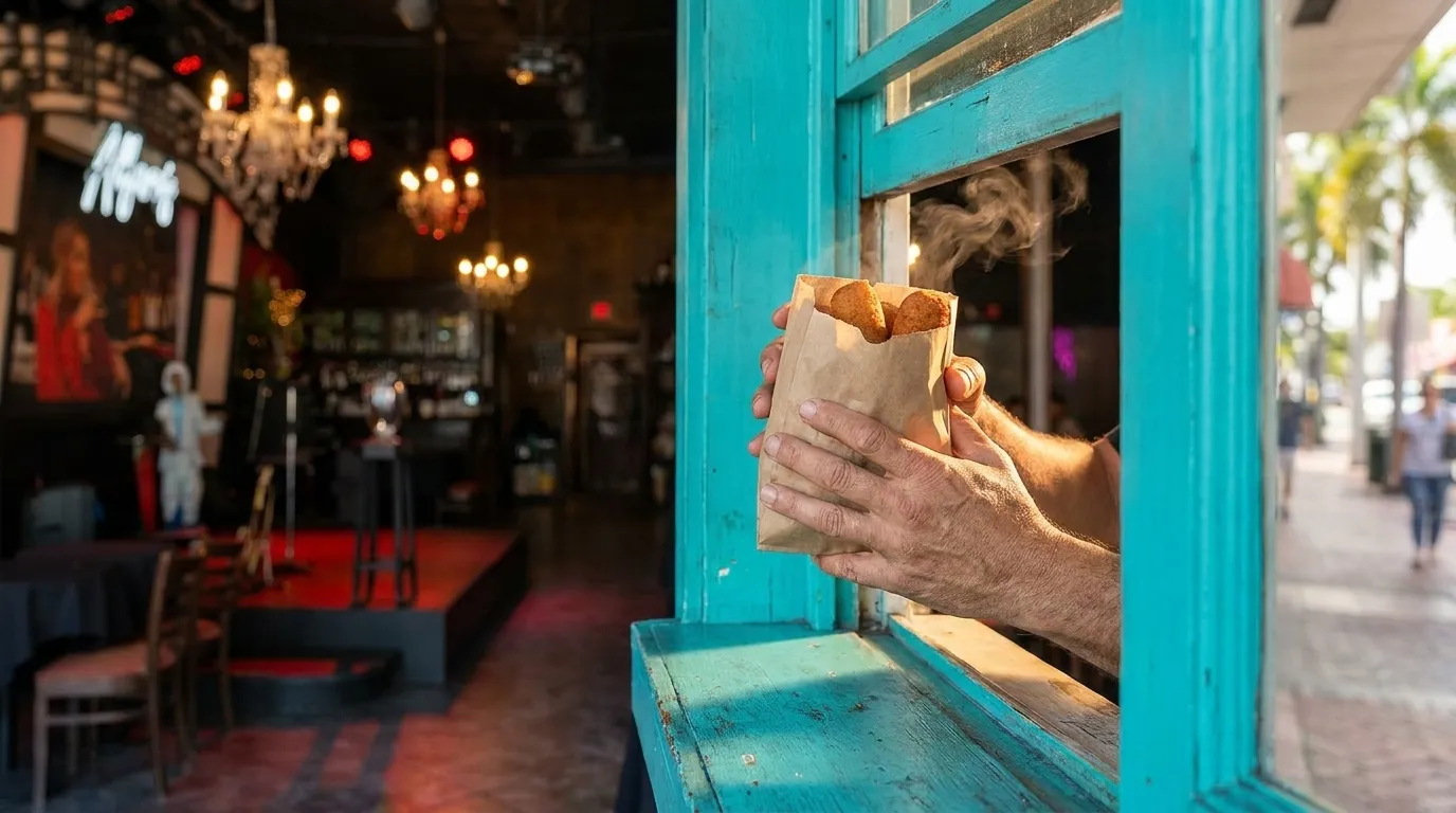 Croquetas being served through a ventanita window in Little Havana