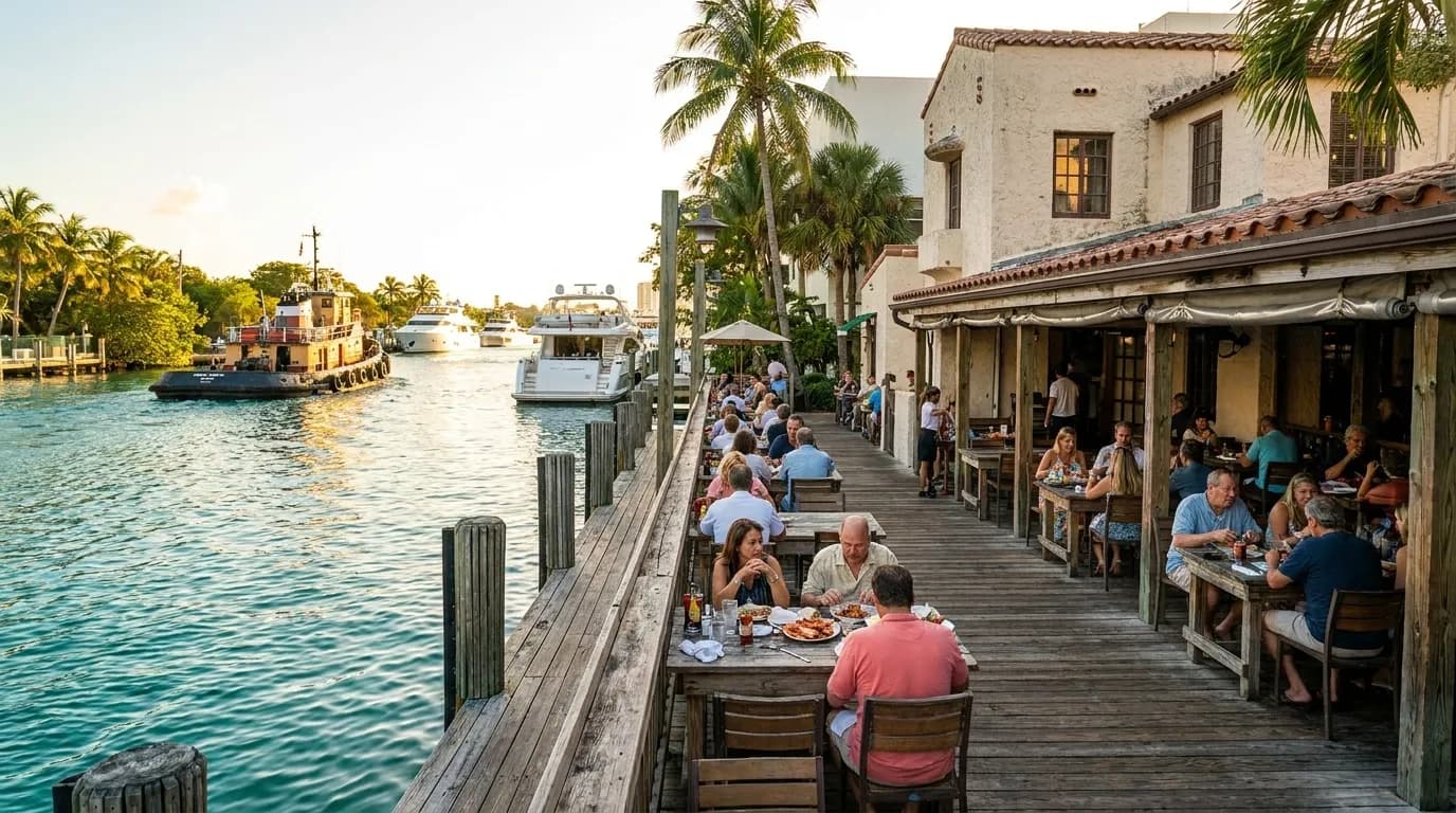 Garcia's Seafood waterfront deck overlooking the Miami River with boats passing by