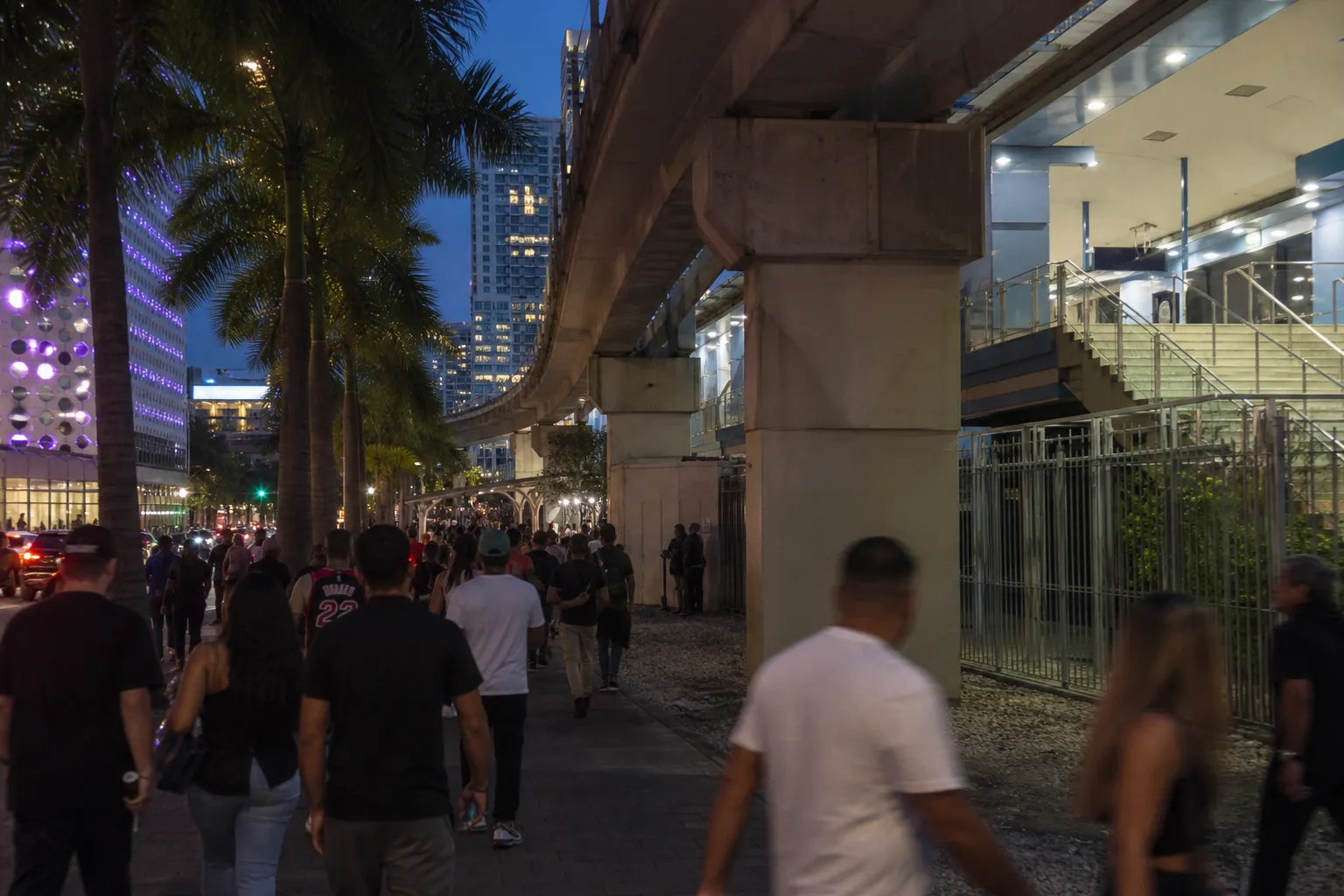 Wide public plaza near Brickell with people heading toward bars