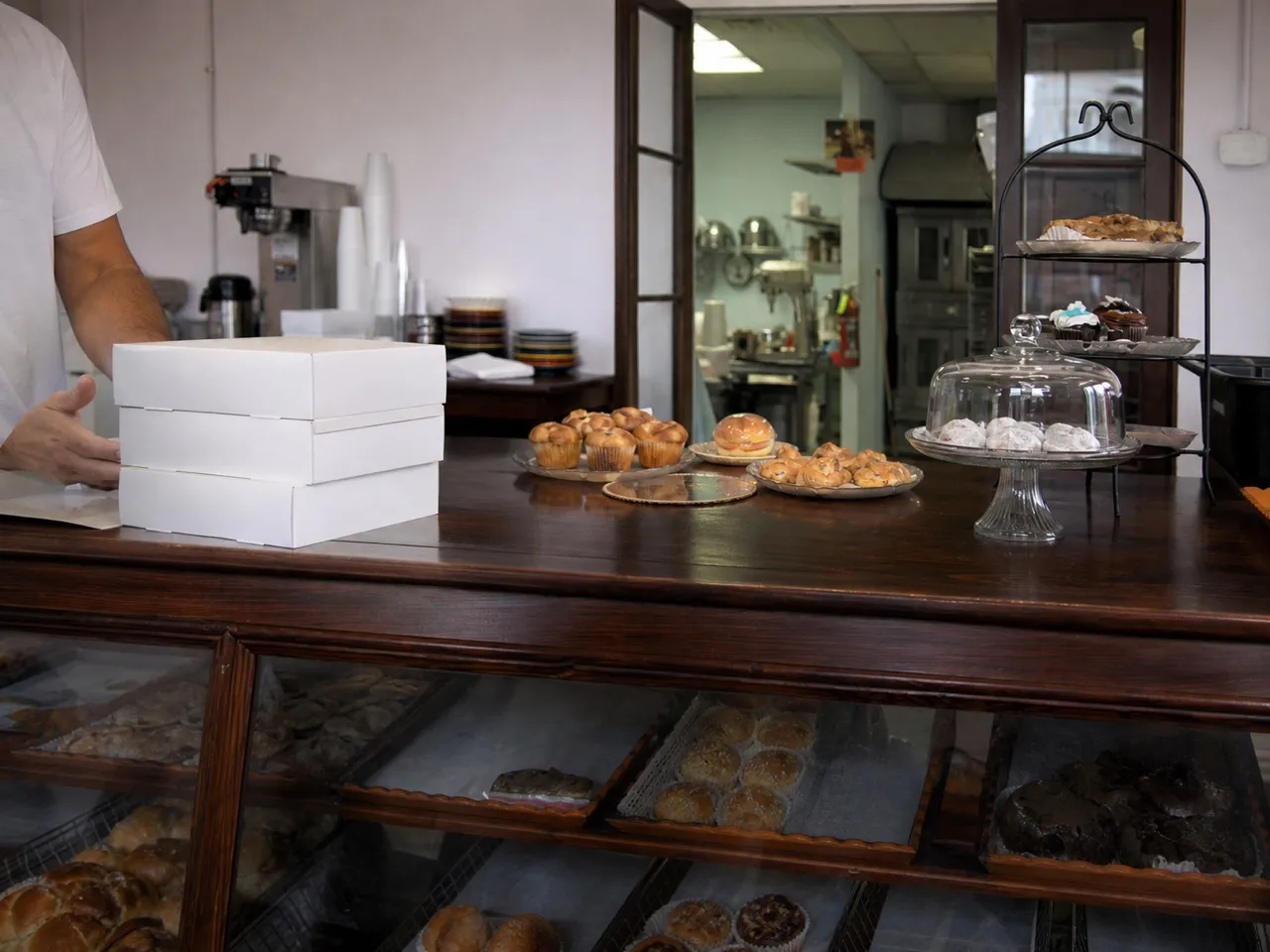 Small Miami shop counter with a glass case and stacked boxes