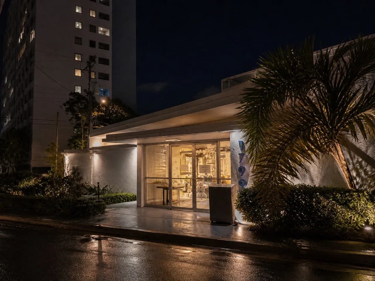 Miami studio building lit from inside in the evening