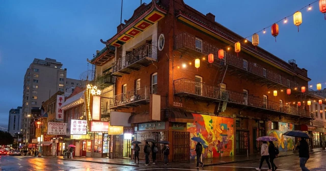 Warm-lit Chinatown restaurant entrance at night