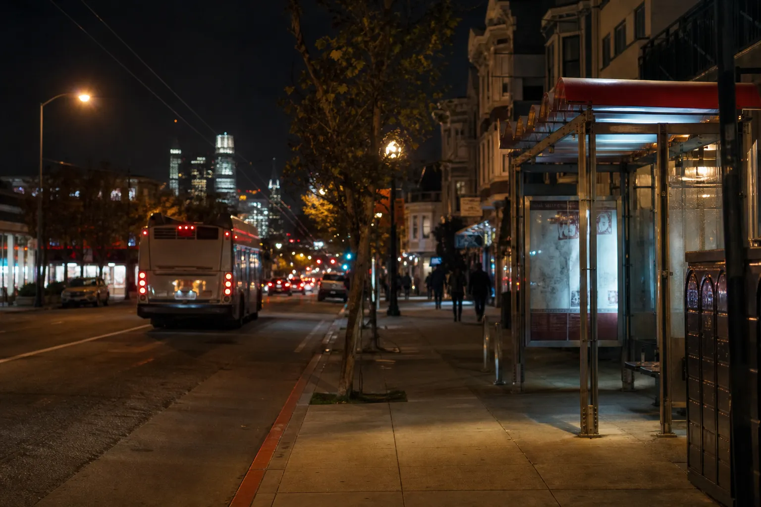 Late-night transit stop near the Mission with city lights and quiet curb activity