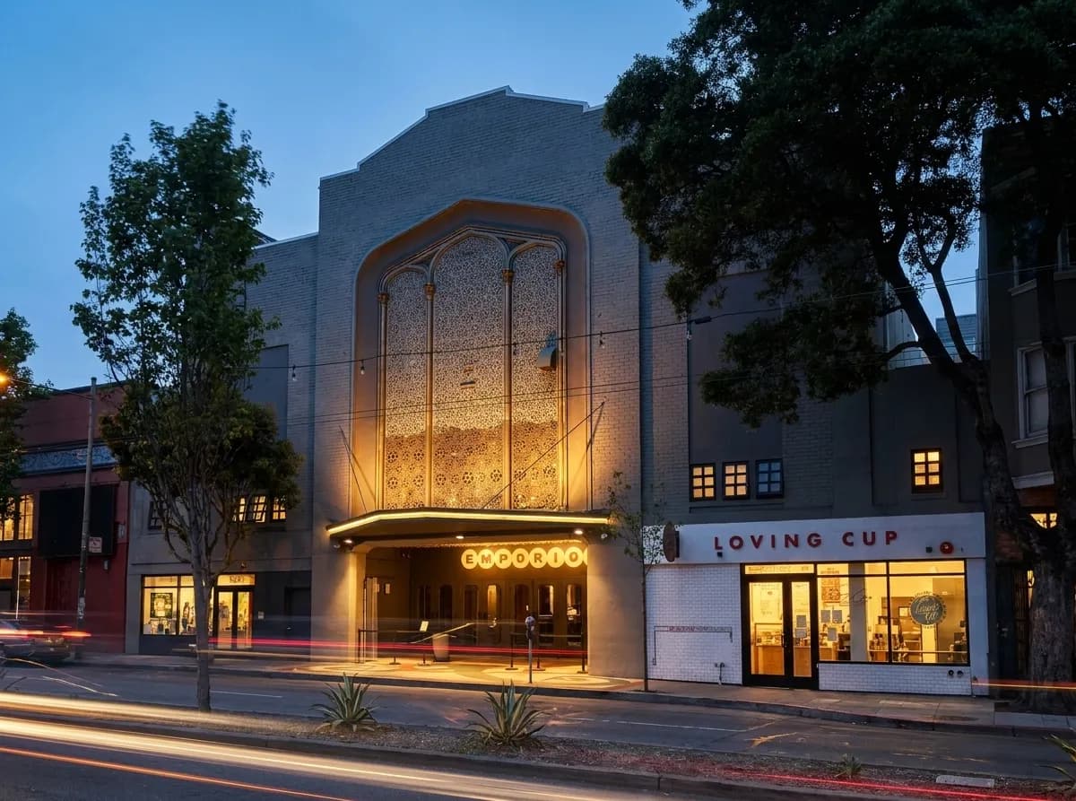Historic Harding Theater facade on Divisadero Street at dusk, illuminated marquee and brick exterior visible