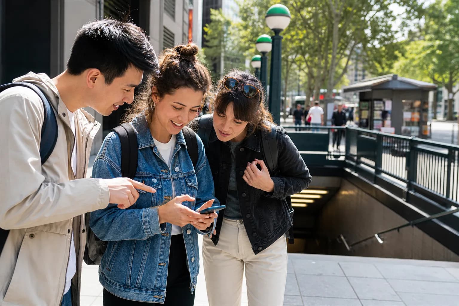 Friends choosing a signal fallback route near a subway entrance