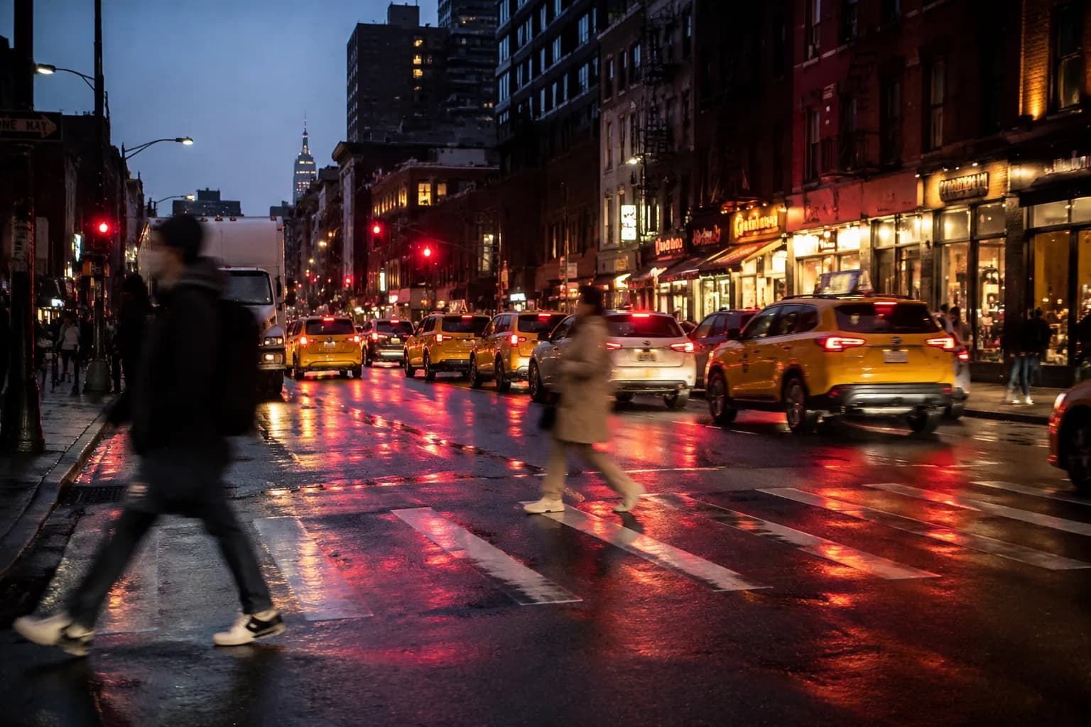 Ninth Avenue in Midtown West at dusk with traffic and restaurant lights
