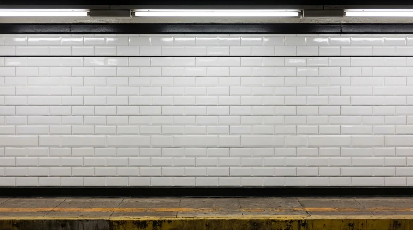 White tile wall and platform edge at First Avenue subway station
