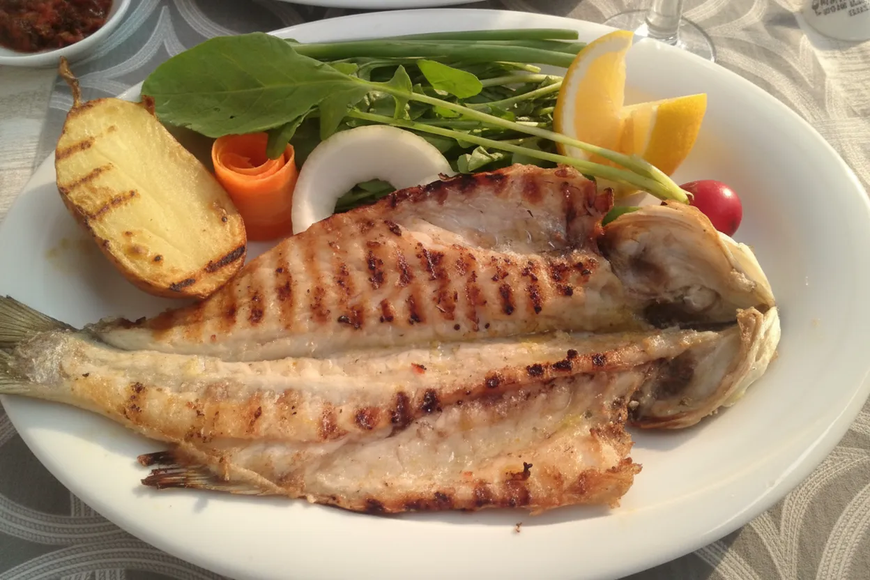 Grilled whole fish at an Astoria Greek taverna