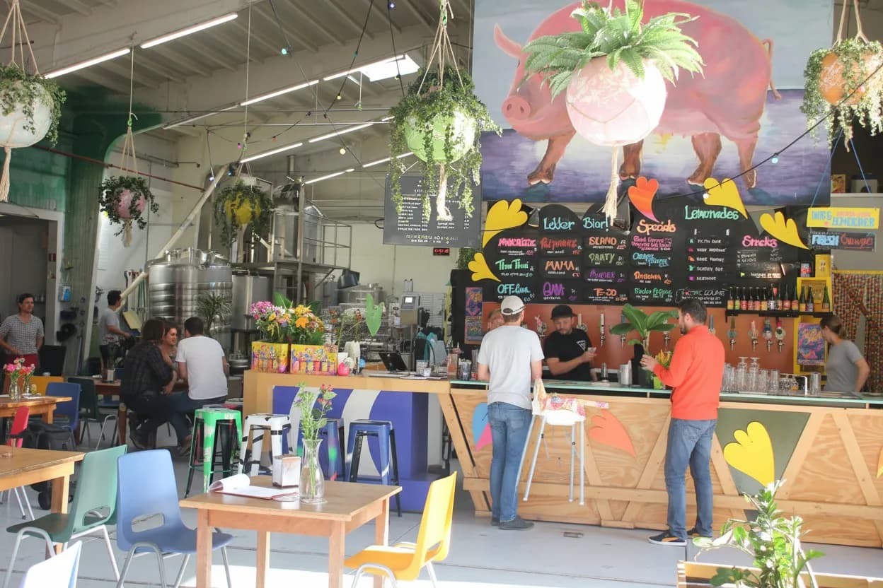 A lively brewery taproom with taps and flights
