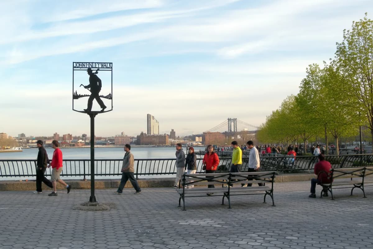 An East River park promenade on a bright day