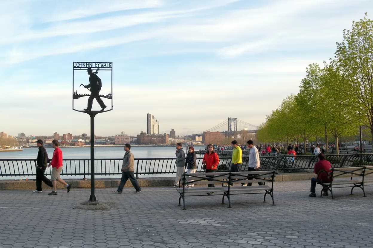 An East River park promenade on a bright day
