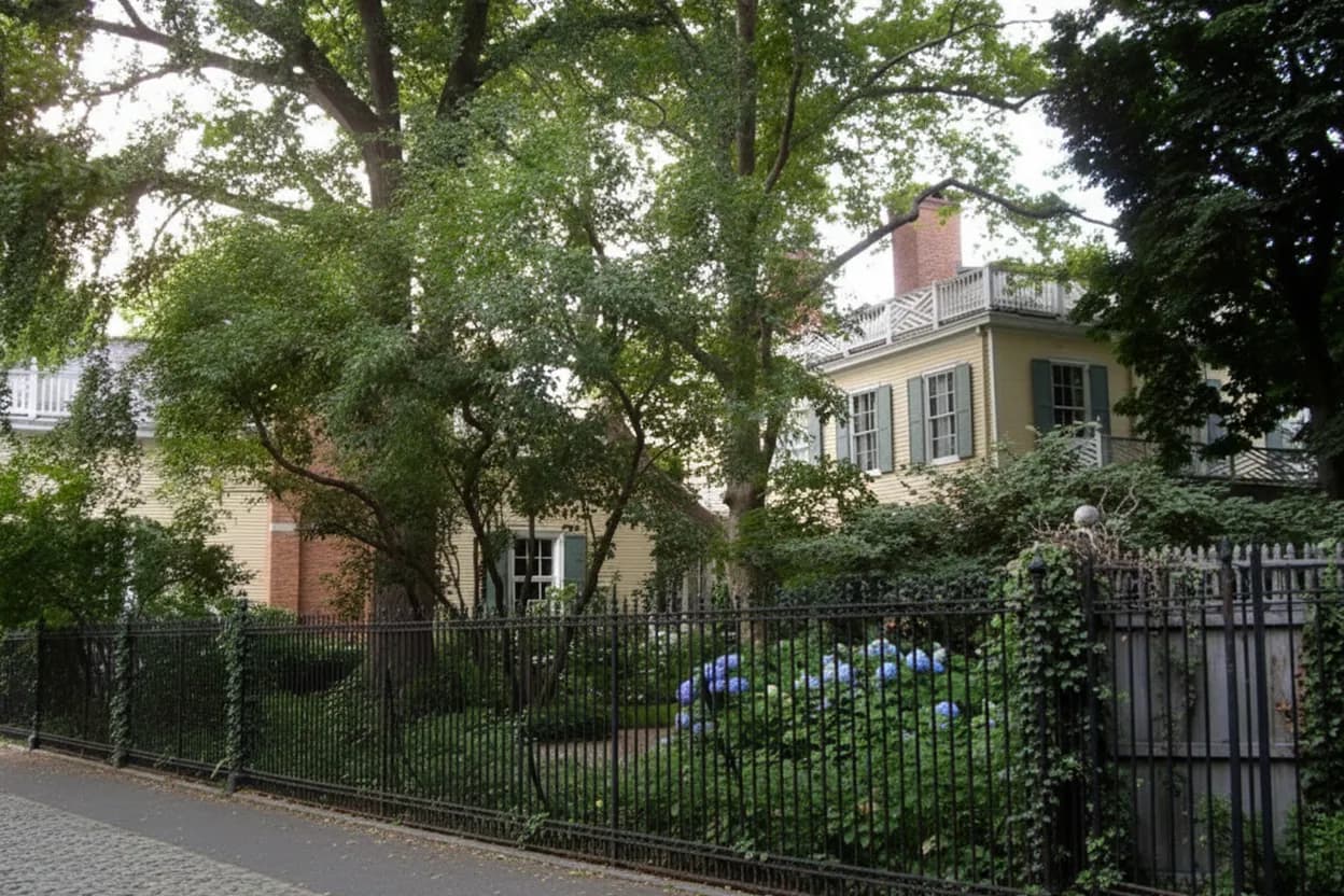An 18th-century wood-frame mansion in a leafy park
