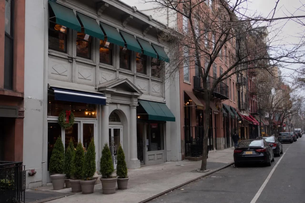 Manhattan side street of ground-floor restaurants in early evening