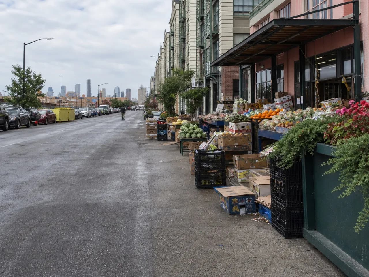 Busy Brooklyn commercial avenue with market stalls on the pavement