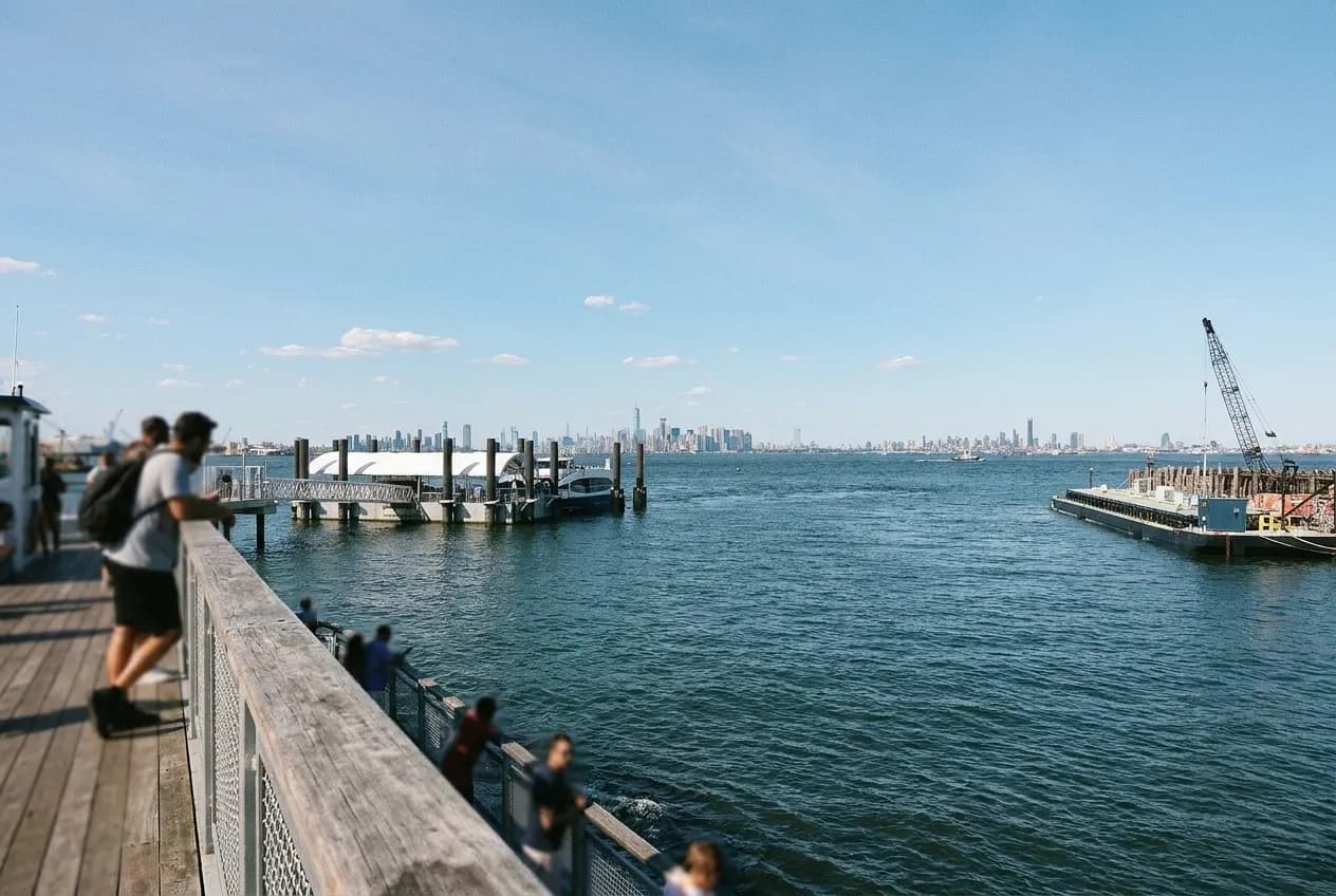 View across New York harbour from a ferry deck with the skyline behind