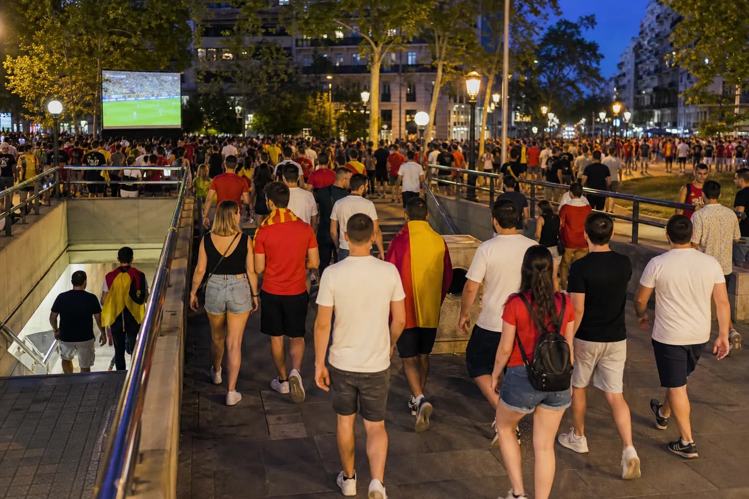 Soccer fans leaving a public screening area with a clear exit plan