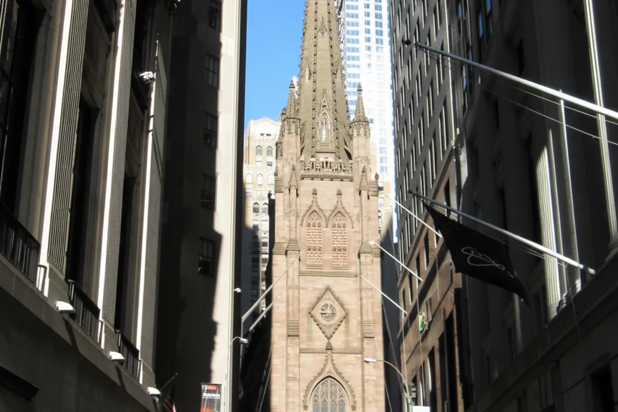 A Gothic church steeple among Financial District towers