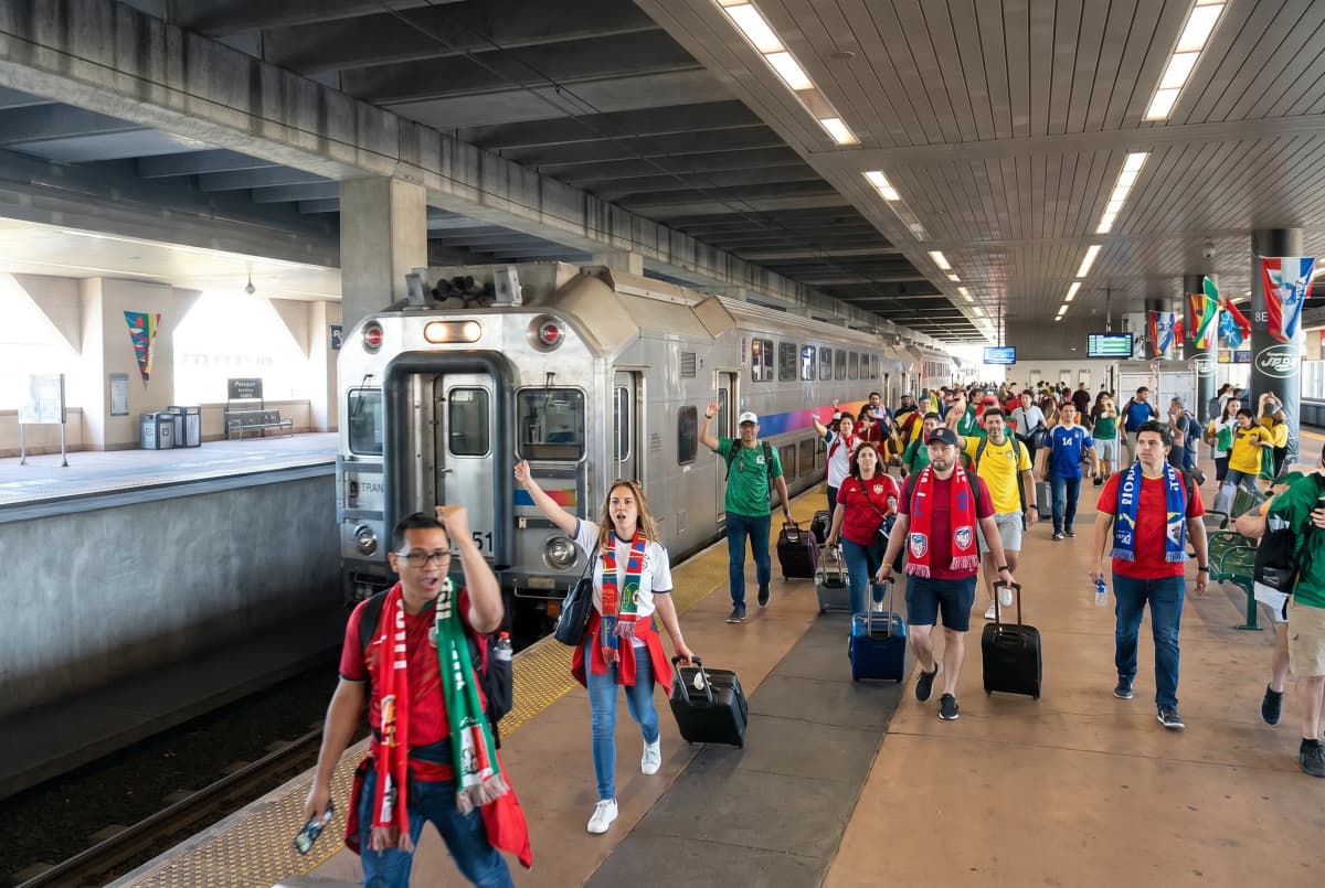 World Cup supporters arriving by train at a New Jersey transfer station.