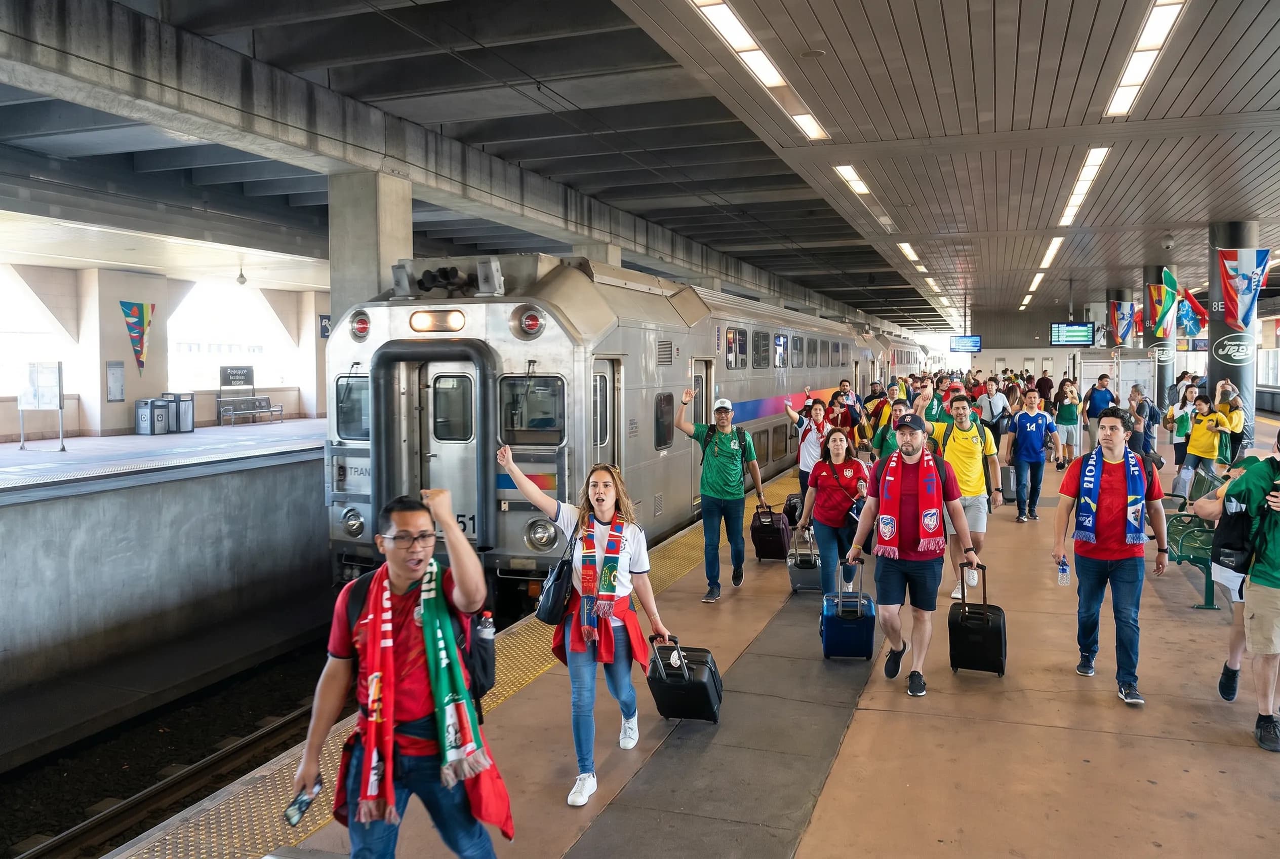 World Cup supporters arriving by train at a New Jersey transfer station.