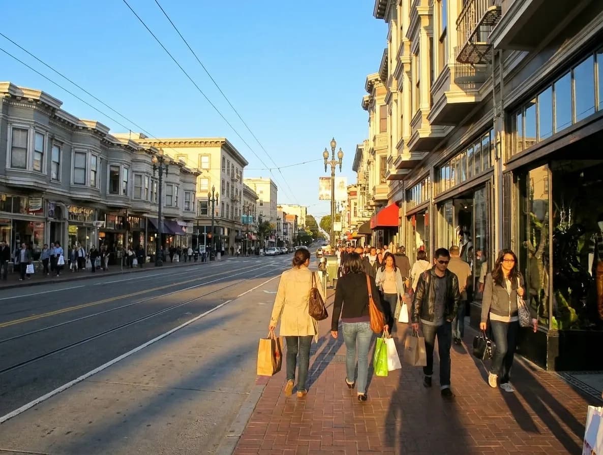 Market Street in San Francisco's Castro district with retail storefronts and Muni tracks