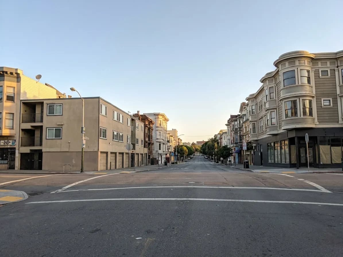 Corner of Haight and Pierce Streets in Lower Haight with Victorian buildings and morning streetscape