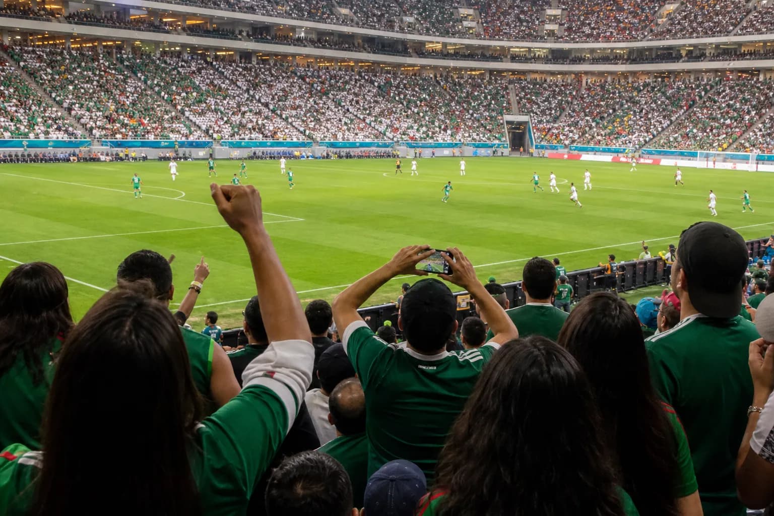 Supporters analyzing striker movement and service in a public watch room