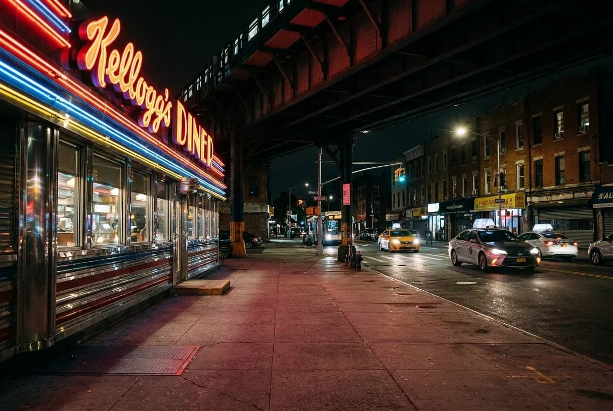 Kellogg's Diner exterior at night with neon signage and chrome trim on Metropolitan Avenue corner in Williamsburg