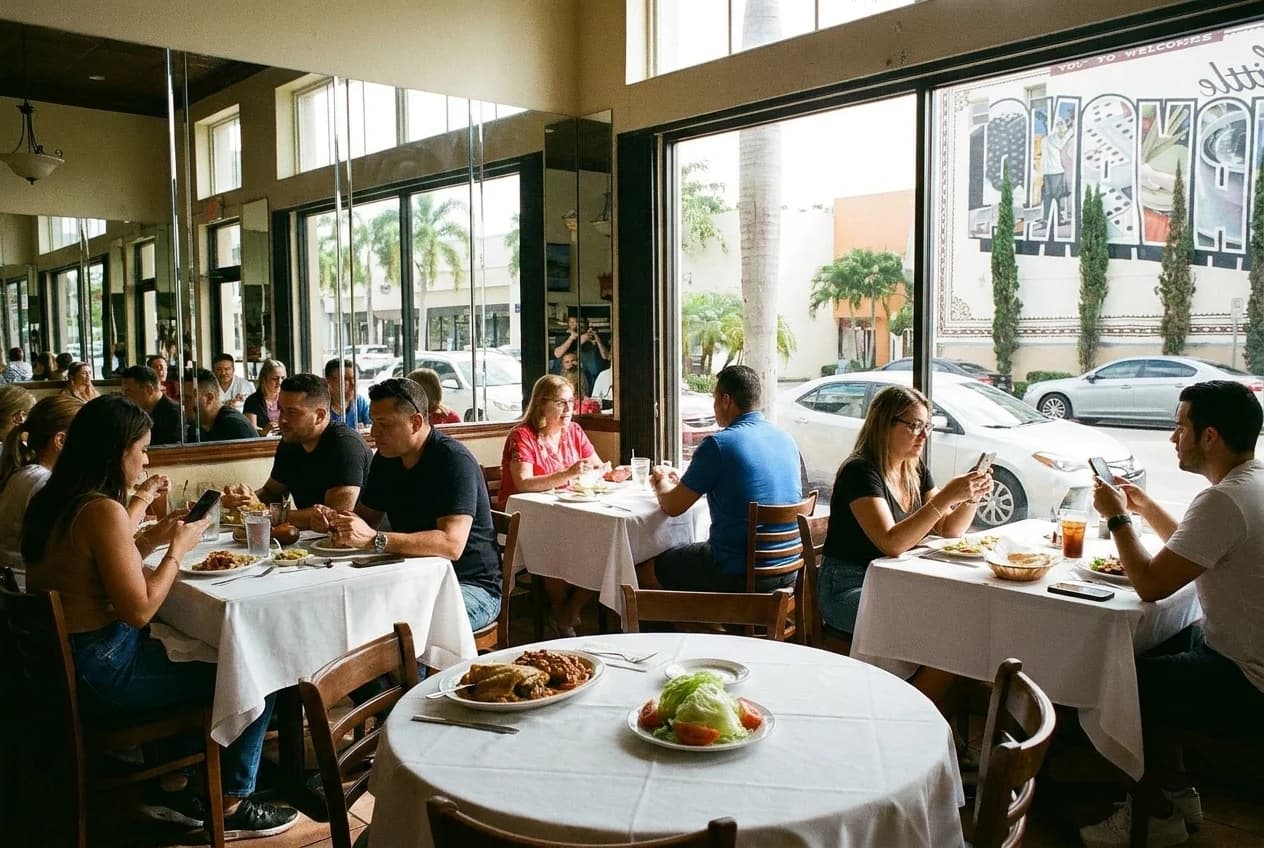 Cuban restaurant interior with mirrored walls and side salad on white tablecloth