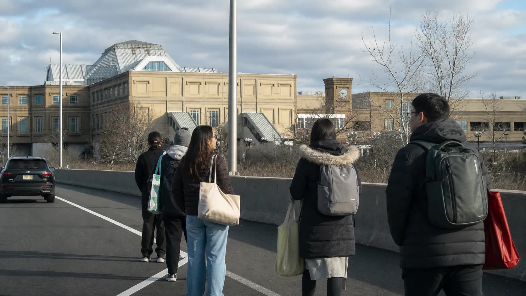 Commuters outside a Secaucus transit station preparing for a shopping trip.