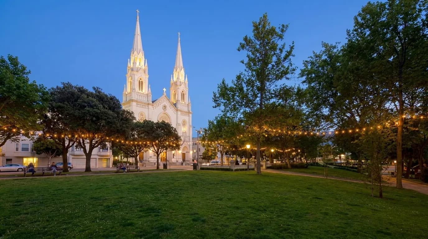 Washington Square Park at dusk with Saints Peter and Paul Church illuminated in North Beach
