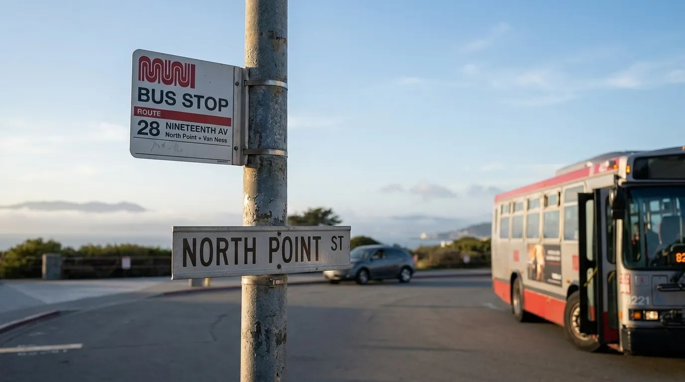 San Francisco Muni bus stop sign in late afternoon, showing route information for park-bound transit lines