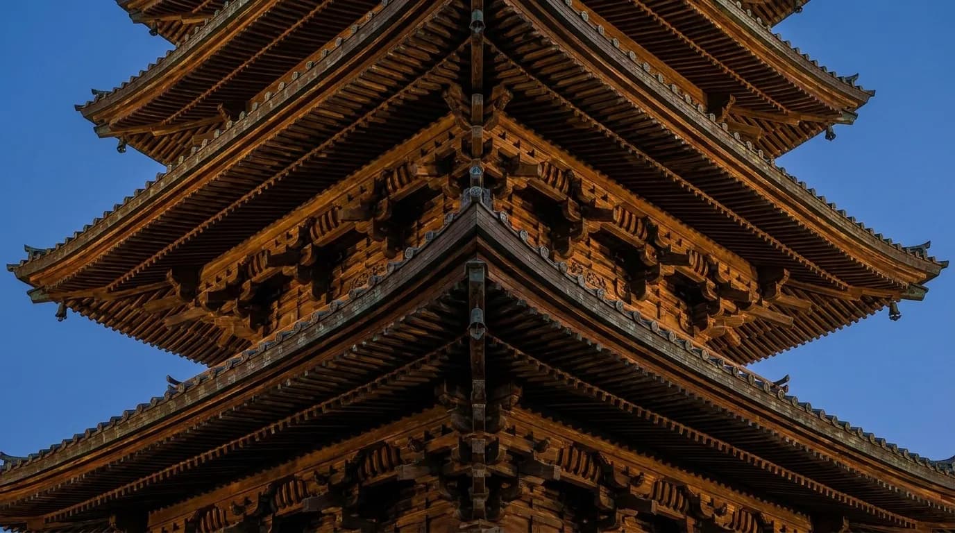 Architectural detail of the Peace Pagoda roof in San Francisco's Japantown, illuminated at night