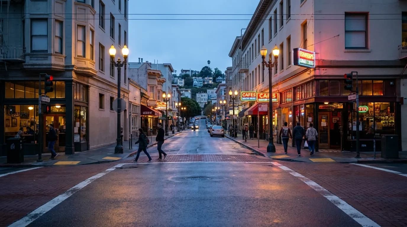 Grant Avenue in North Beach at dusk with neon signs and pedestrians near folk music venues