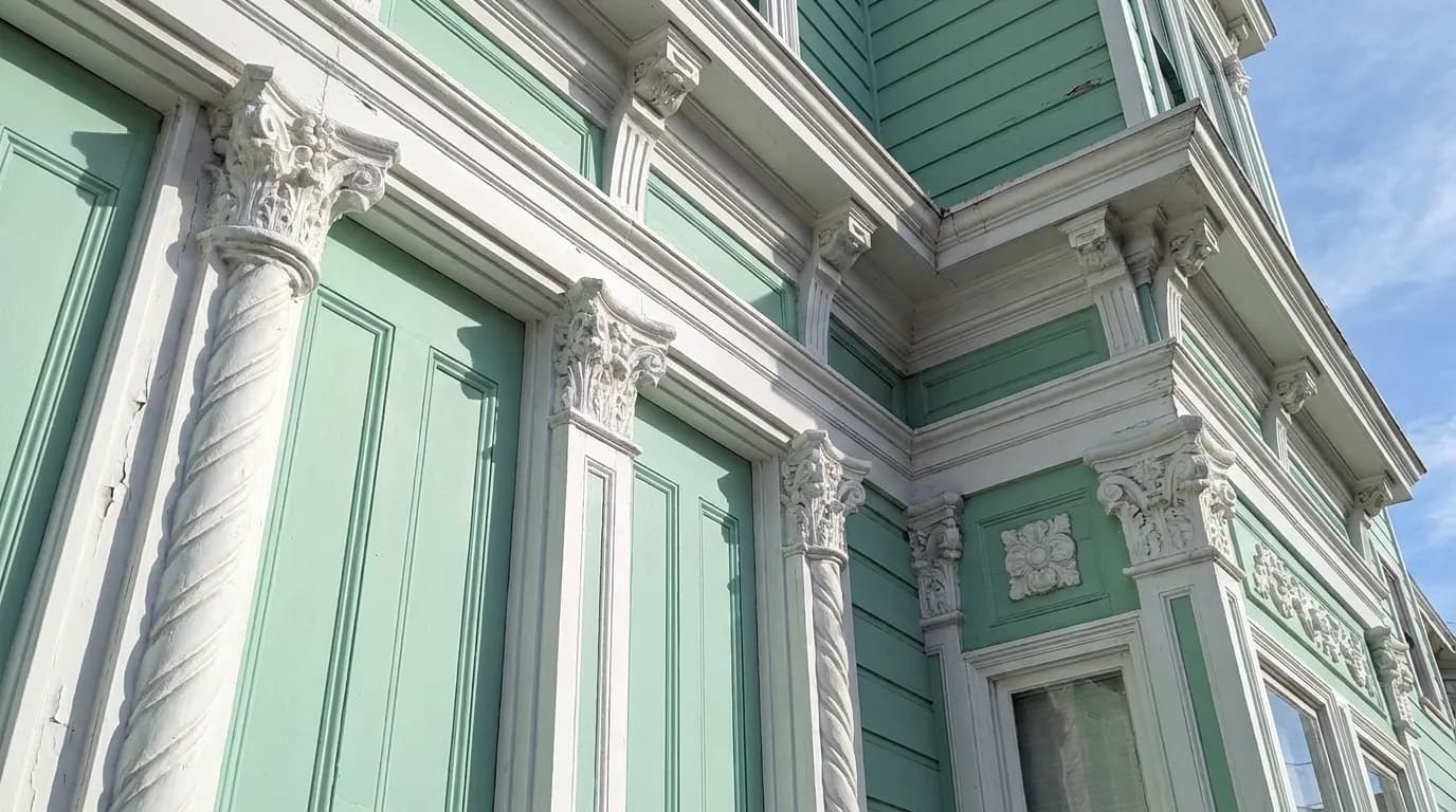 Detailed view of painted Victorian trim on a Noe Valley house, showing craftsmanship and morning light