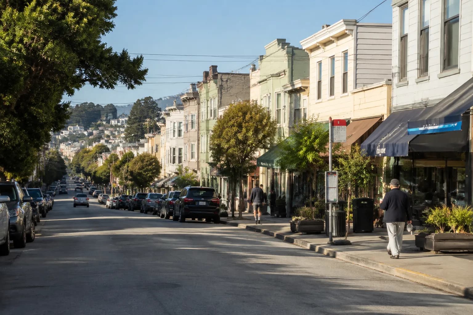 24th Street in Noe Valley on a Saturday morning with storefronts, a bus stop, and early shoppers