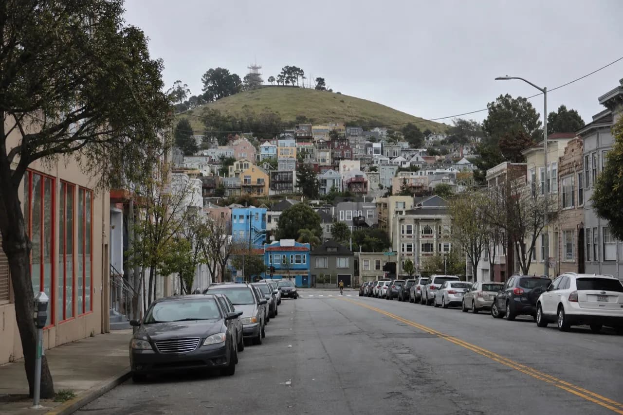 San Francisco street climbing toward an open hilltop